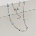 Close-up of stainless steel Evil Eye necklace with blue enamel beads and bar links - 42+5cm / Horizontal Oval Green Eye & Bar