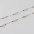 Detail showing stainless steel bamboo chains with white acrylic beads for DIY jewelry making - White
