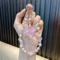 Handmade pink crystal butterfly beaded phone strap and keychain with iridescent pearls - Pink