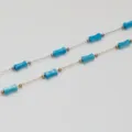 Detailed view of turquoise bamboo beads on gold and silver stainless steel chains - Steel Color Chain / Sky Blue