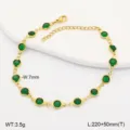 Detail view of a gold stainless steel anklet with vibrant green circular glass stones. - 21.5cm / Dark Green
