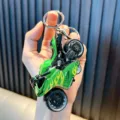 Detailed green toy motorcycle keychain featuring yellow flame patterns and GTR print - Green