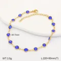 Close-up detail of a gold stainless steel anklet set with circular blue glass beads. - 21.5cm / Blue