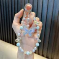 Iridescent crystal butterfly beaded phone strap with pearly lavender and blue beads - Blue