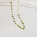 Close-up detail of the green square sugar crystals on a gold stainless steel chain - Light Green