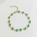 Elegant gold-toned stainless steel anklet featuring multiple blue heart-shaped crystals - Lake Blue
