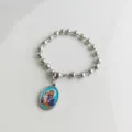 Detailed view of silver stainless steel beaded bracelet with a religious saint pendant - Saint Joseph Portrait