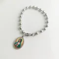 Detailed view of a stainless steel bead bracelet with a Virgin Mary oval pendant - Virgin Mary (Green/Yellow) Portrait
