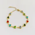Detailed view of a colorful heart-shaped gem bracelet in gold-plated stainless steel - Multicolor