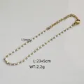 Close-up detail of stainless steel gold-tone anklet featuring 1.5mm white drip oil beads - Steel / White