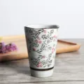 Detailed macro view of a Japanese style ceramic tea cup with elegant floral patterns. - 201-300ml / Tang Flower Pattern