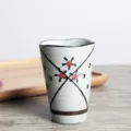 Detail shot of a Japanese ceramic matcha tea cup with hand-painted floral patterns. - 201-300ml / Starry Night