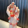 Handmade cherry beaded phone strap featuring red crystal beads and cute cherry charms - Including Card Packaging And Gasket / Red