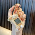 Handheld mini controller Tetris game console keychain with a cute capybara design in cream - Turtle / Beige