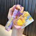 Cute little yellow duck gourd keychain with liquid quicksand and purple GenkiKun strap. - Purple