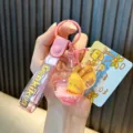 Cute GenkiKun little yellow duck liquid gourd keychain with pink quicksand strap charm - Pink