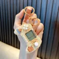 Mini retro handheld game controller keychain featuring cute Capybara cartoon design - Bathing / Beige