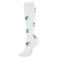 Close-up view of white sports compression calf socks featuring a green leaf pattern design - S/M / White Green Leaf