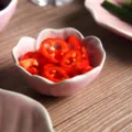 Japanese pink flower shaped ceramic sauce dish with petal texture on wooden table - Noodle Bowl / 5.5 Inches / Pink