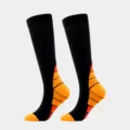 Black sports compression calf socks with orange geometric gradient pattern design - Orange