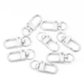 Macro view of several silver alloy spring lobster clasps for DIY keychain making - Keychain (U-Shaped) / 5 Pieces / Silver