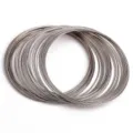 Silver colored memory steel wire coils for DIY jewelry making bracelets and rings. - 0.6mm Thickness 6cm Diameter (50 Rings/Pack) / Nickel Color