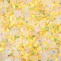 Macro detail of yellow iridescent sequins in heart, star, and circle shapes - 20g Pack / Yellow Mixed Style