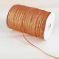Close-up detail of metallic orange glitter ribbon on a white spool for DIY jewelry making - 4mm 20 Yards Pack / Orange Red