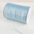 Macro detail showing the texture of light blue glitter metallic ribbon on a spool - 4mm 20 Yards Pack / Blue