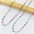 Detailed view of colorful enamel heart charms on stainless steel link chain necklaces - Multicolor