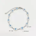 Bracciale in acciaio inossidabile con perle malocchio e catena di estensione regolabile - 45+5cm / Bianco