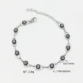 Bracciale occhio del male in acciaio inossidabile argento, 2,8g, perline 6x11mm - 45+5cm / Nero