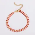 Elegante bracciale a spina di pesce in acciaio inossidabile dorato con dettagli in smalto rosso - Collana / Rosso