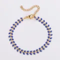 Elegante bracciale a catena a spina di pesce in oro con segmenti in smalto blu - Blu