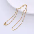 Close-up detail of a minimalist gold facet-cut cross chain necklace on white plate - Chain Only (Without Pendant) / 0.5mm Diameter / Gold