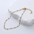 Detailed view of stainless steel anklet with blue enamel beads on a stone background - 23+3cm / Blue