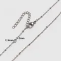 Close-up of 2.5mm bead detail on a 2mm stainless steel satellite chain necklace - 42+5cm / Steel