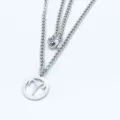 Detailed view of a stainless steel Aries zodiac necklace with a cutout pendant. - Steel Style / 45cm Chain / Aries