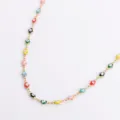 Close-up of colorful enamel evil eye charms on a gold stainless steel chain necklace - Multicolor