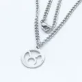 Close-up detail of a stainless steel Taurus zodiac circular cutout pendant on curb chain - Steel Style / 45cm Chain / Taurus