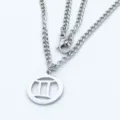 Detail view of a stainless steel Gemini zodiac necklace with circular hollowed pendant - Steel Style / 45cm Chain / Gemini