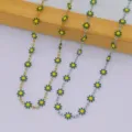 Detailed view of three stainless steel daisy necklaces in gold and silver metal finishes - Green (Silver Tone)