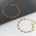 Braccialetti margherita in acciaio inossidabile oro e argento con fiori rossi smaltati. - Oro / Rosso