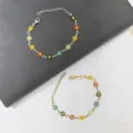 Braccialetti colorati a margherita in acciaio inossidabile con catene argento e oro. - Multicolore