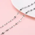 Macro shot of silver stainless steel sunflower loop chain for DIY jewelry making - 0.8 Lip Chain / 1 Meter/Pack (Width approx. 3.6mm)