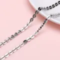 Detailed macro shot of silver stainless steel petal chain link for DIY jewelry making - 4.5 Cross Heart Link Chain / 1m/Pack (Width approx 4.5mm)