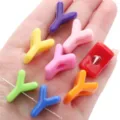 Brightly colored Y-shaped acrylic beads displayed on a hand for DIY jewelry crafts - Letter Y (BSD852) / 10 Pieces (14x22mm) / Random Mixed Colors