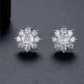 Elegant snowflake shaped cubic zirconia stud earrings in a polished silver finish - Snowflake Style (E23122416)