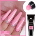 Detalle del gel de extensión de uñas Née Jolie rosa caramelo y resultado de manicura - Rosa Caramelo (10)