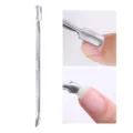 Professional close-up of a dual-ended stainless steel cuticle pusher used on fingernails - Small Cuticle Pusher